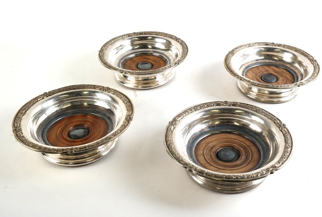 Four Silver-plated Wine Coasters: Four Silver-plated wine coasters. [7 1/4" Dia x 3" H].