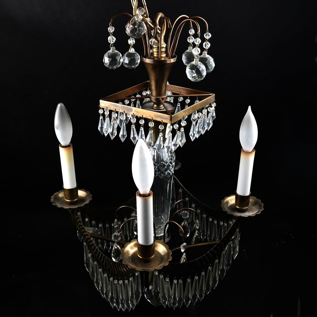 French Bronze Four-Light Fixture: French swag-form bronze and crystal four light chandelier. [15" Dia. x 24" H].