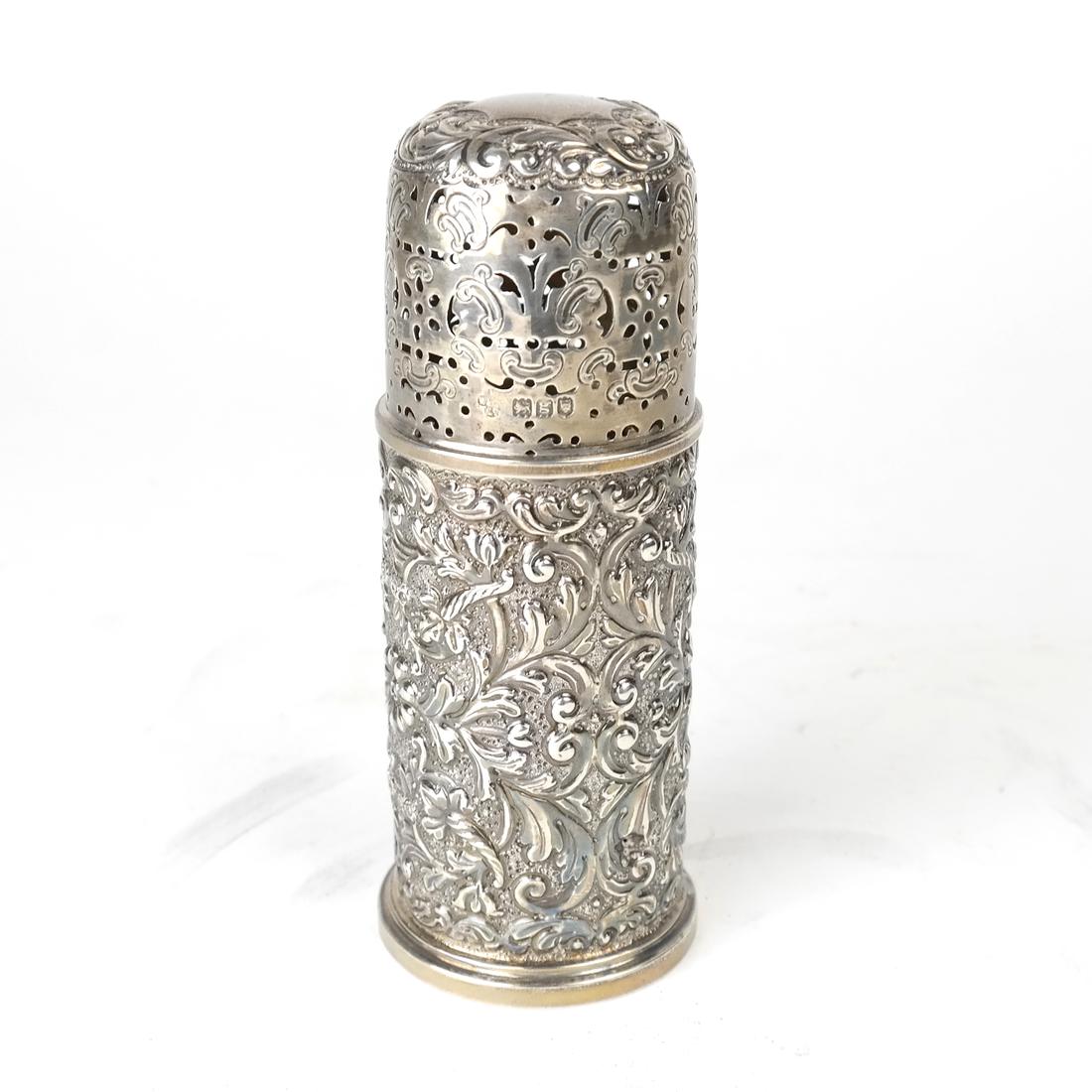 Edwardian Sterling Muffineer: With rubbed marks for London, 1902. Chased and pierced stylized foliate decoration. [5 1/4" H x 2" Dia]. Marks rubbed, light wear overall. 3 ozt.
