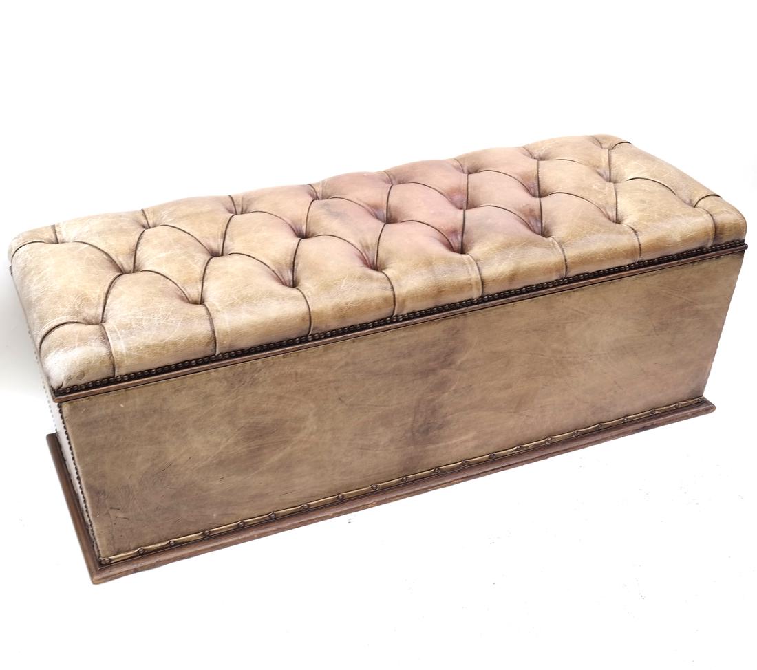 Brown Leather Hinged Trunk: All around leather trunk with a tufted leather upholstered top. [17 1/2" H x 48" L x 18" D]. Good condition, leather is worn, as with age.