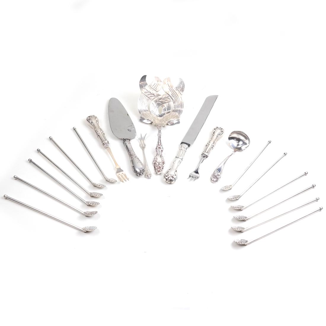 Eighteen Various Silver Utensils: Second Half 20th Century, comprising: 12 stirrer-straws; an asparagus server; 2 various olive forks; a pastry slice; a bread knife; a lemon fork. Together with a silver-plated sauce ladle; [Weight app