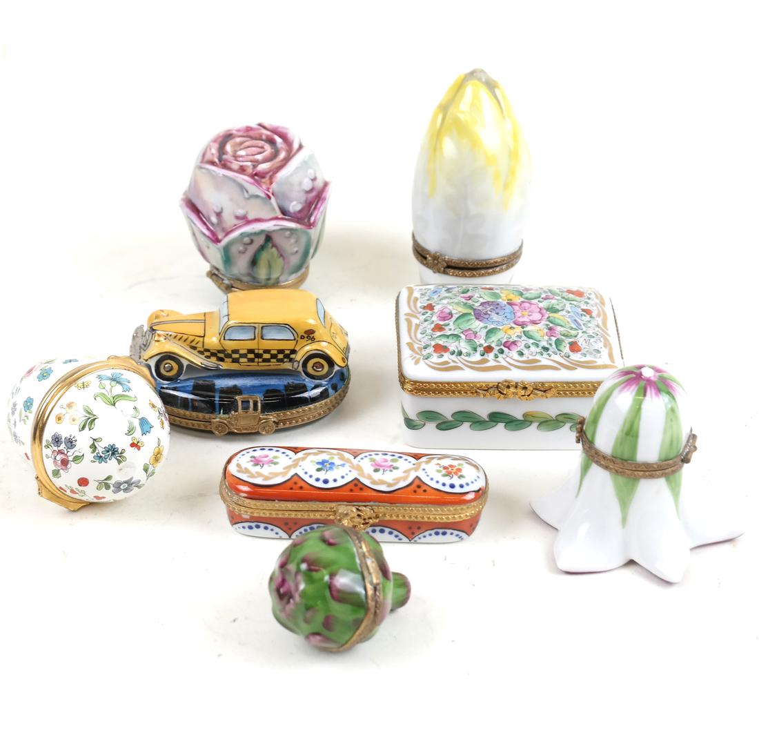 Group of 8 Limoges and Battersea Boxes: Includes 7 decorated Limoges pill boxes and on Battersea pill box. All in good condition.