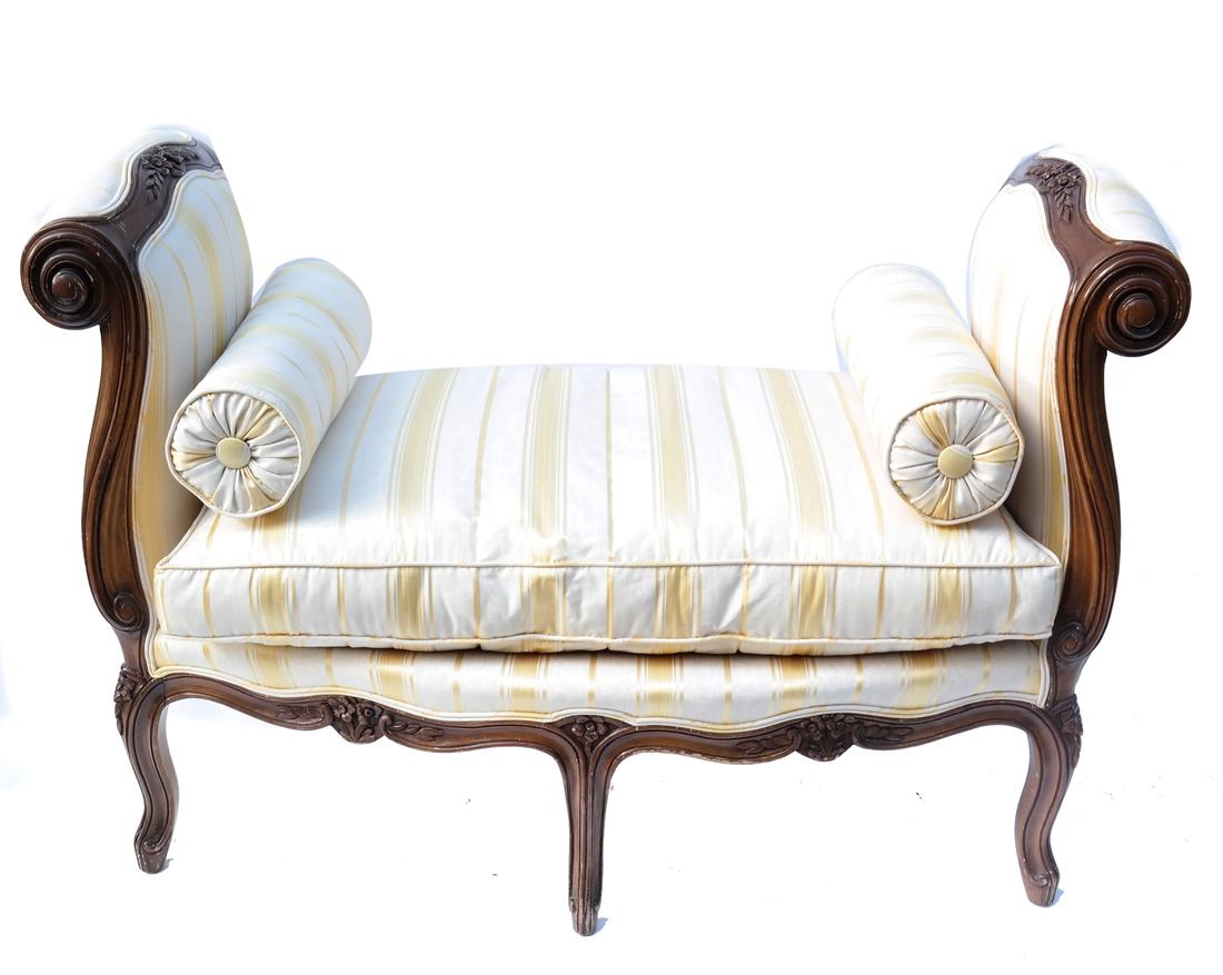 French Provencial Window Bench: Antique walnut gold and creme striped upholstered six-leg window bench. [42" x 22" x 34" H; 19" H to seat]. Upholstery torn.