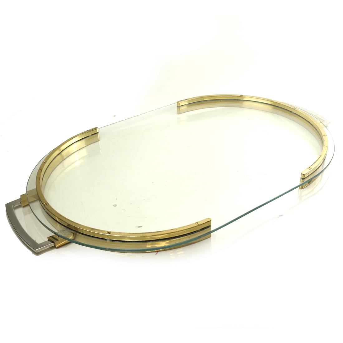Brass and Glass Butler's Tray: Oval glass butler's tray in a two-tone frame. [29" x 17" x 1 1/2" H]. Brass gallery with scratches through out, otherwise overall good condition.