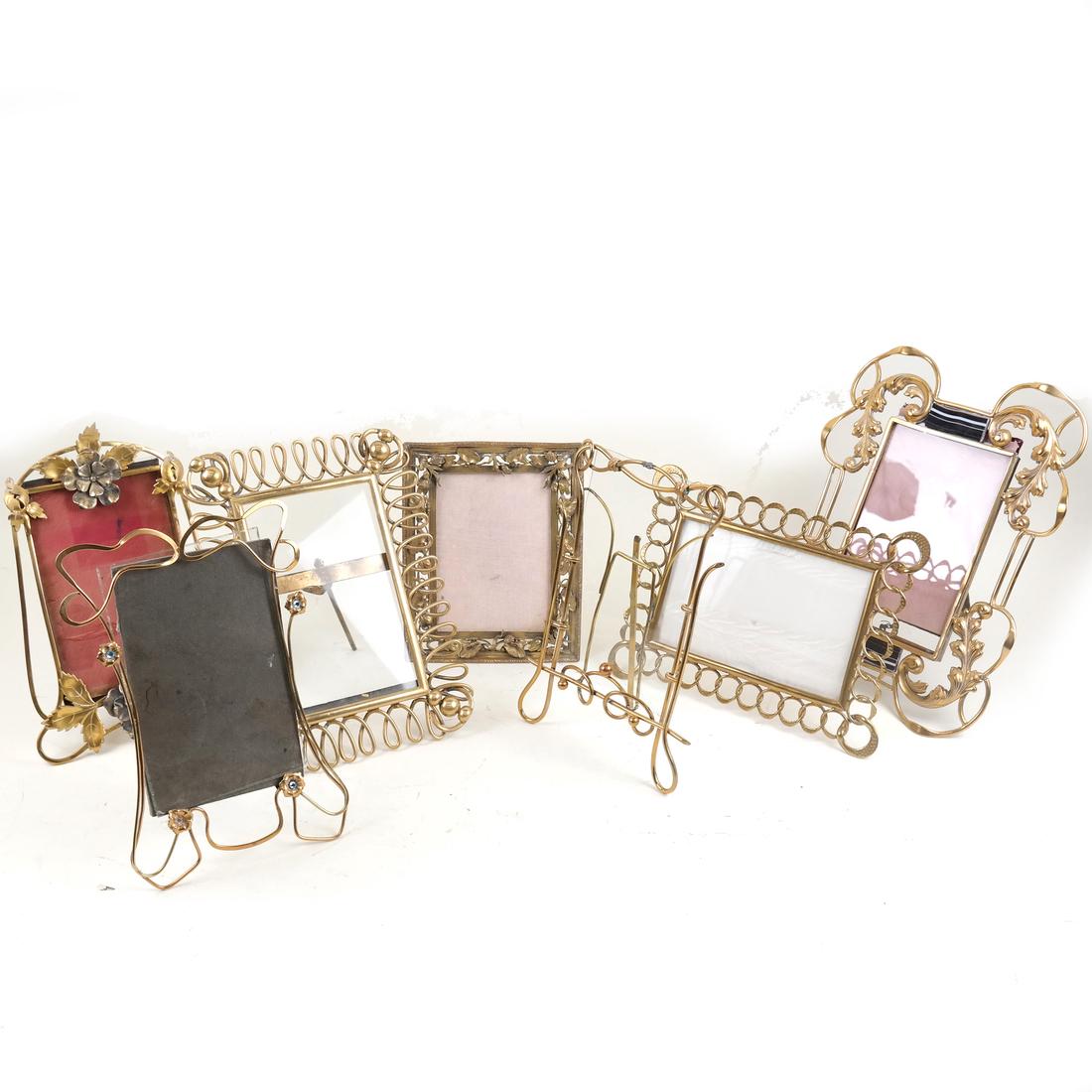 Seven Various Gilt Metal Picture Frames: Comprises six frames, each with open work detail together with a floral decorated gilt metal frame. [Largest: 11 1/2" H x 9" W].