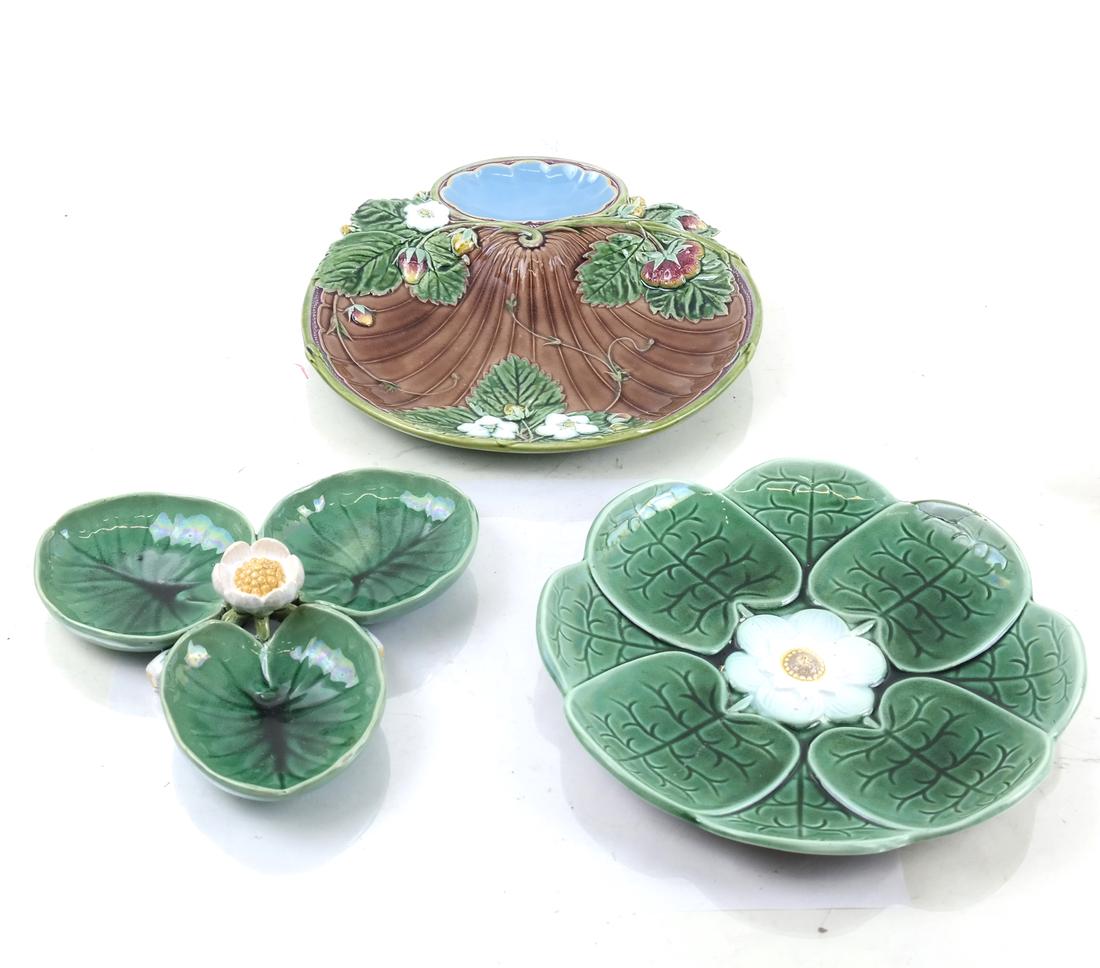 3 English Majolica Serving Dishes: by Mintons, late 19th century, including 2 each molded and decorated with pond lilies and a strawberry plate, underside of two impressed "Mintons;" [H: 1in to 1 1/2in; Dia: 6 1/2in to 8 3/4in]; Restor
