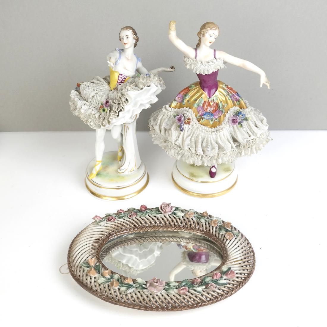 Three Porcelain Items: Comprising a pair of Dresden ballerinas and an oval mirror. [6 1/2" - 7 1/2" H]. All sold "as is", figures missing hands.