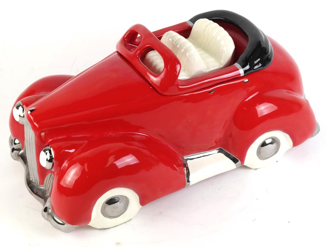 Glenn Appleman Car-Form Cookie Jar: The cookie jar in the form of a red convertible. Signed and dated in felt tip "Appleman / 1979" with apple-shaped monogram, and impressed "H 77" on the underside of base.. [14 1/2" x 8 1/2" x 7 1/2" H