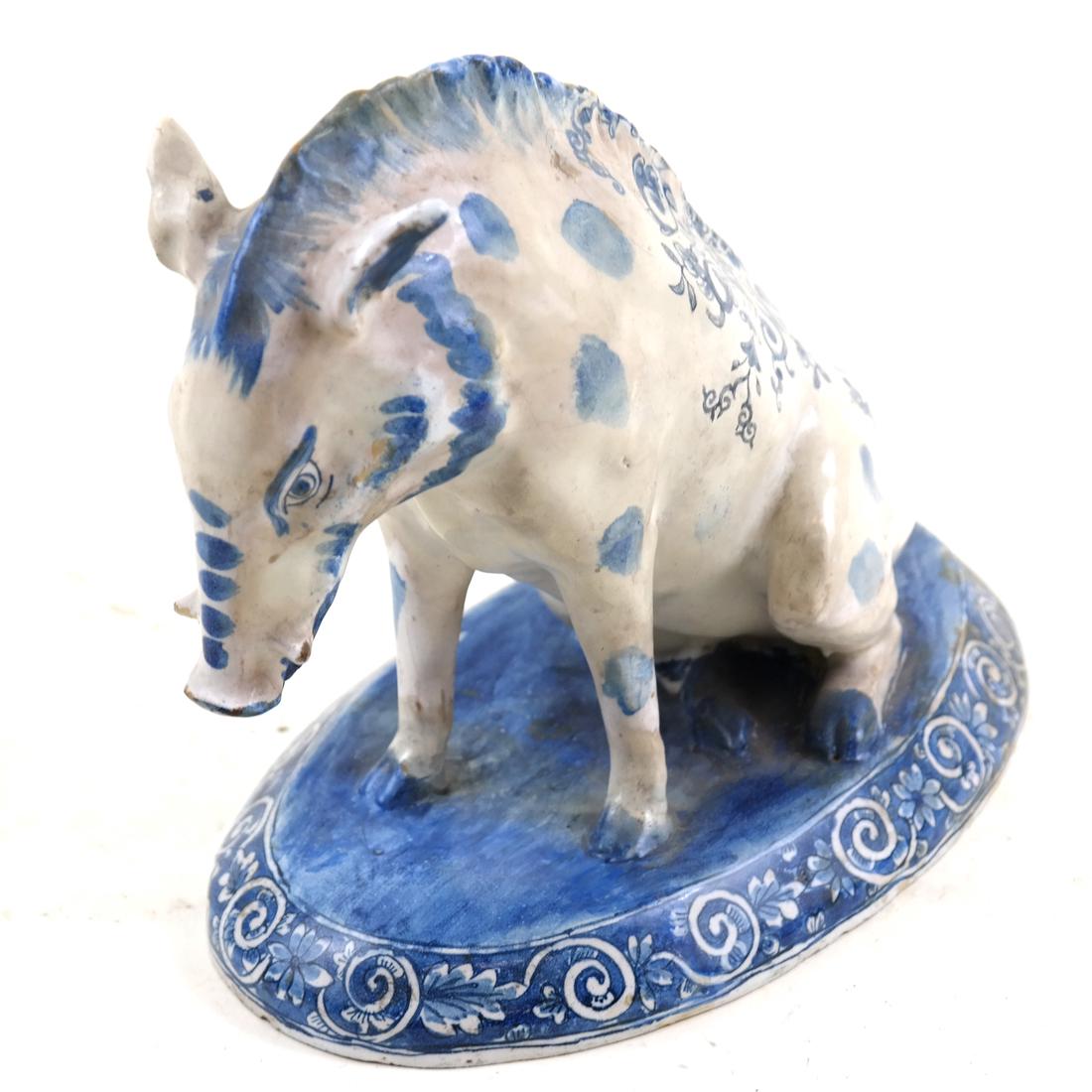 Faience Boar: Blue and white decorated porcelain boar. [7" H x 7 1/2' W x 4 1/2" D].