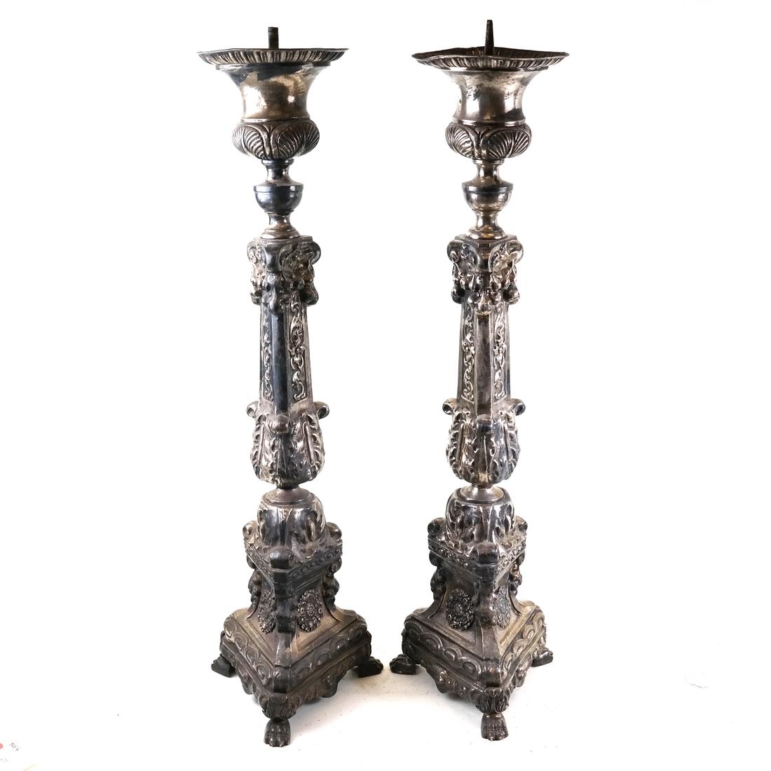 Pair of Rococo-Style Pricket Sticks: Silvered metal, ornately decorated pricket sticks. [29" H x 7 1/2" x 7 1/2"].