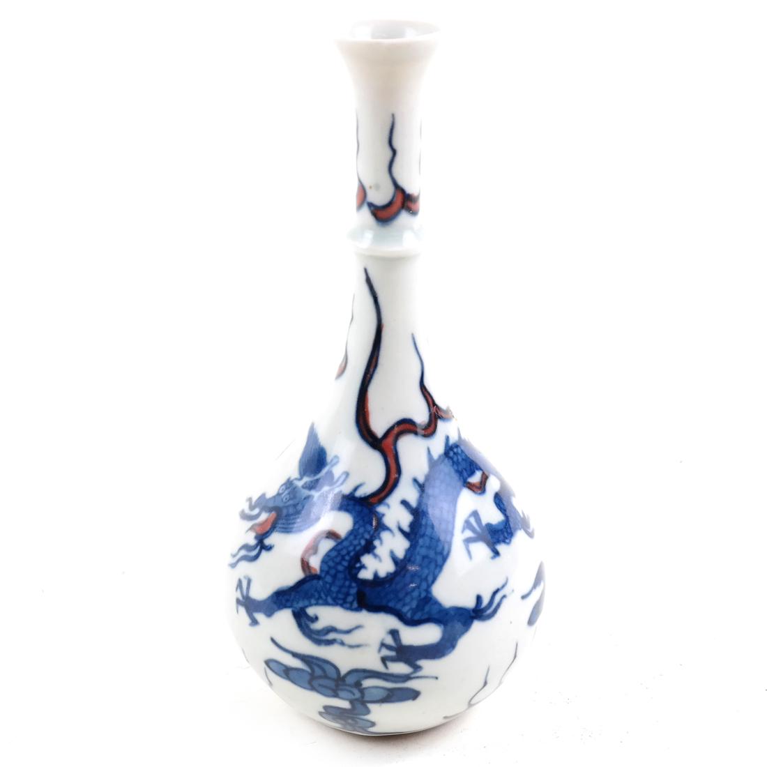 Chinese Blue & White Dragon Vase: 20th century, bulbous or gourd form porcelain vase with an elongated neck and flaring lip. Decorated with a stylized dragon, with an Artemisia leaf mark on underside of base. [6 1/2" H x 3" Dia].