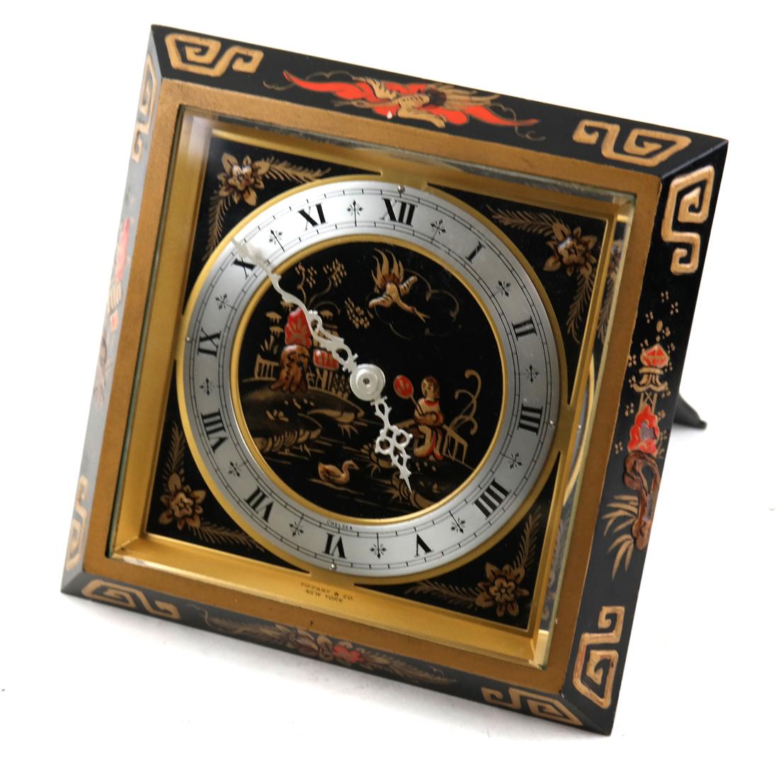 Tiffany & Co. New York Chelsea Clock: Chinoiserie enameled bronze clock with bevel cut crystal and hinged strut support. [6 3/4" Sq x 5 1/2" deep when opened].