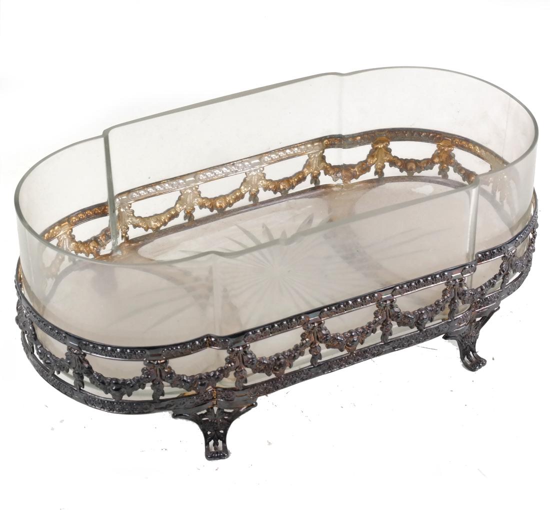 Silver Plate and Glass Centerpiece: Early 20th century, the shaped rectangular frame decorated with festoons, on scroll feet. [4 3/4" H x 12 1/4" L x 6 3/4" D]. Glass liner with approximately 1/2 inch rim chip (polished), otherwise in g