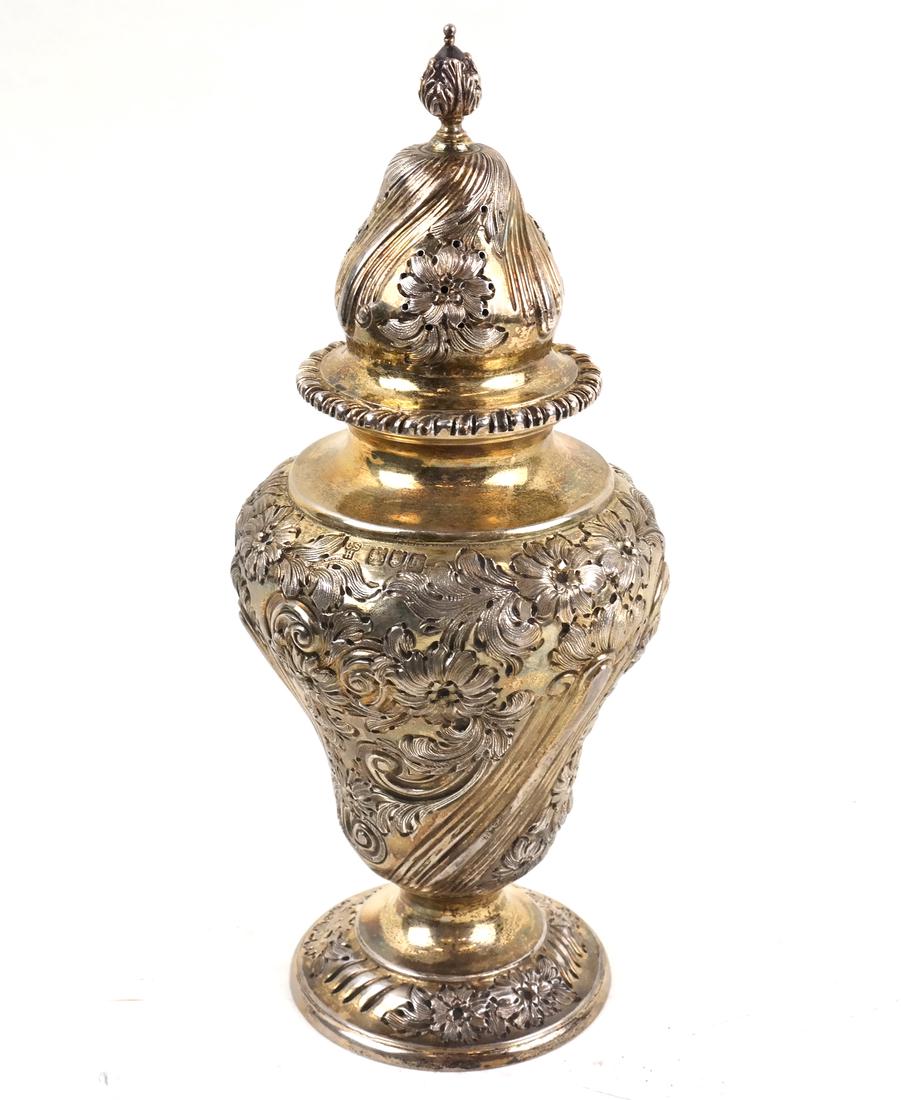 Edwardian Gilt Sterling Caster w/ Box: By Charles Stuart Harris, London, 1903. Of inverted pear-form, chased with swirled borders of reeds alternating with blossoms. With original box. [9" H x 4" Dia]. Some surface wear throughout. Weight