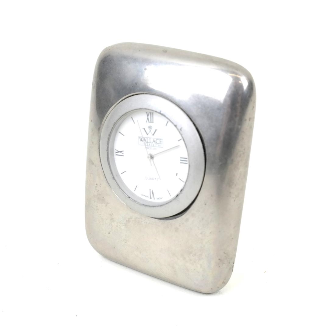 Mid-Century Modern Silver Desk Clock: Wallace Silversmith small silver clock, the face with roman numerals. Dimensions: 3.50 " H x 2.25 " W x 1.00 "D; 