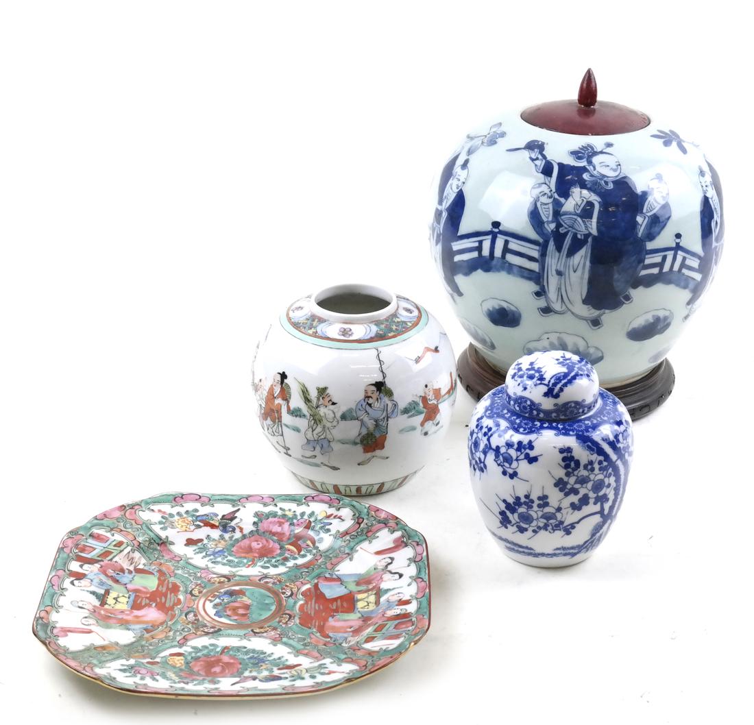 Four Asian Decorated Objects: A rose medallion style plate, a ginger jar with a wooden lid, a small ginger jar lacking a lid and a blue & white covered ginger jar.