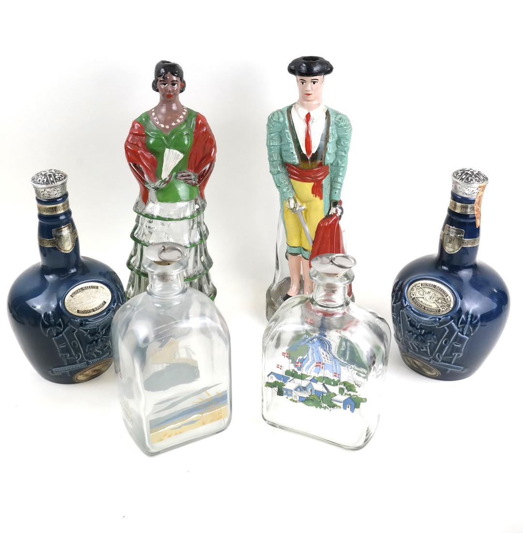 Six Vintage Various Spirits Bottles: Mid-20th century and later, comprising: a pair of Spanish molded and painted glass wine bottles, two matching blue-glazed ceramic Chivas Royal Salute Scotch Whisky bottles, and two Danish glass decant