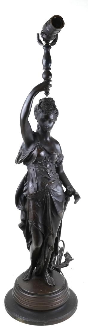 Bronze Classical Female: A sculpture of a classical woman, drilled through upper portion of the arm. [8" Dia. (base) x 27" H (to socket). From the Collection of Will Barnet