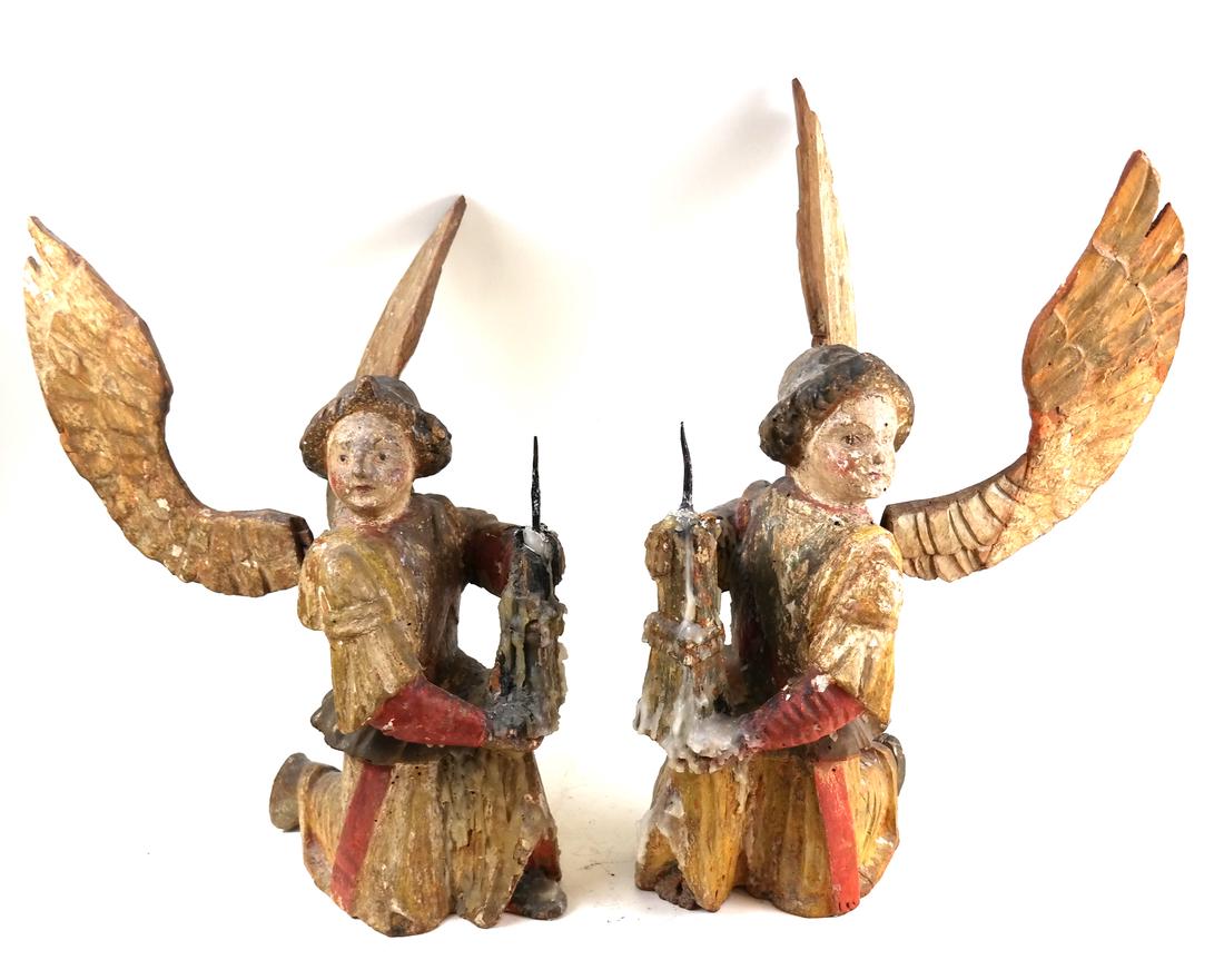 Pair Italian Antique Kneeling Angel Figures: Umbrian School, Circa 1400, each carved and polychrome painted figure holding a pricket candlestick. Dimensions: 17.25" H x 16" H; Provenance: Property from the est