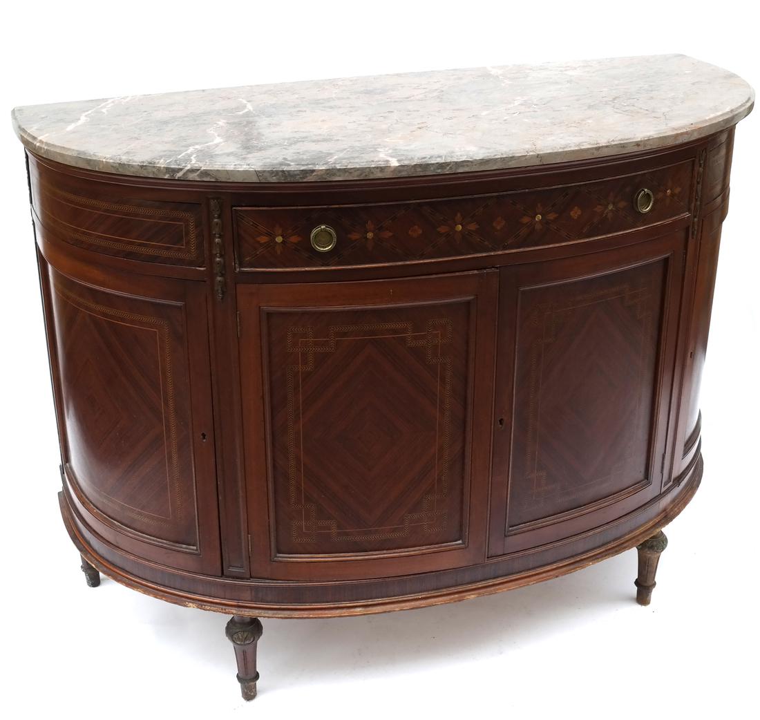 Early 20th Century French Inlaid Commode: Demilune inlay-decorated commode with four cabinet doors and one drawer. Beveled marble top. Dimensions: 37.5" W x 52" D x 23"H; 