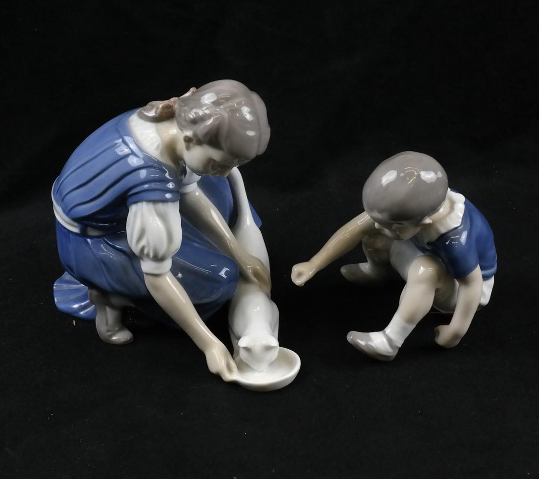 B&G Danish Sculptures of Children: Comprises two blue and white Danish groups by Bing and Grundahl, Denmark. Dimensions: larger - 6" W x 4" D x 5.25"H; 