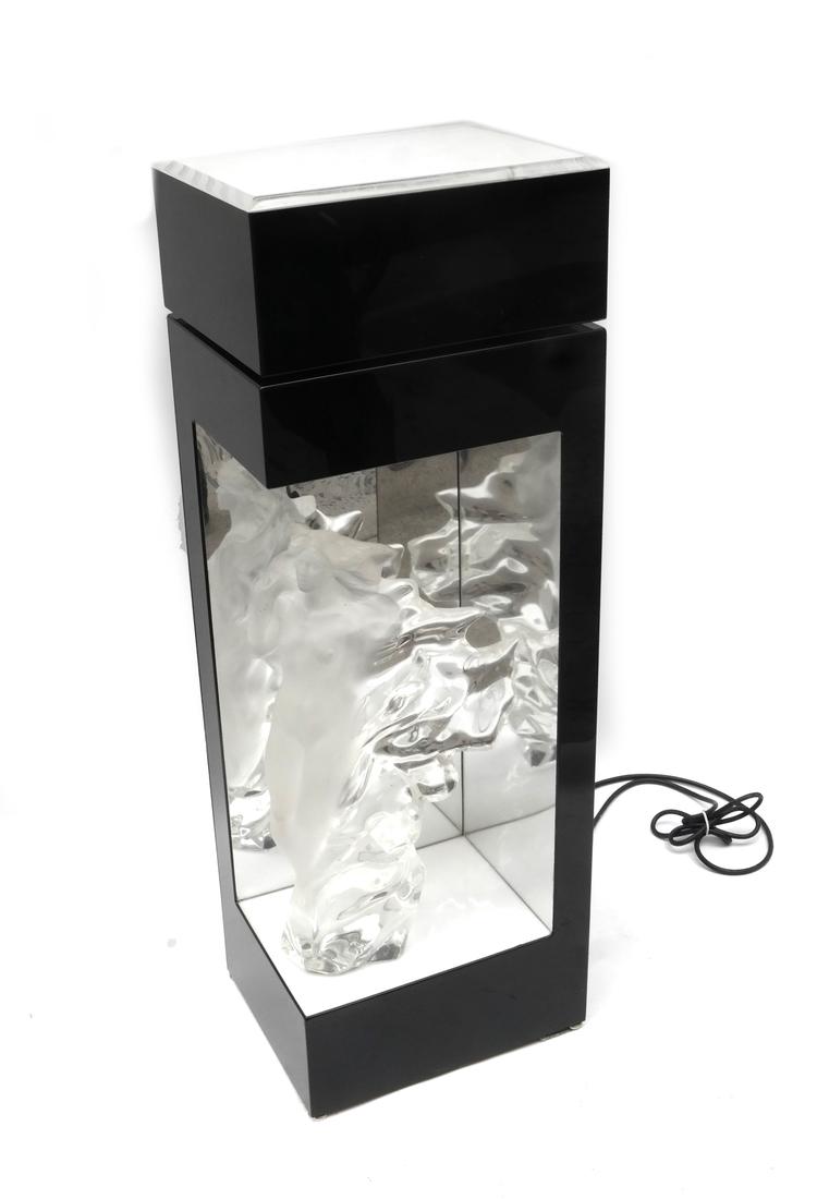 Frederick Hart, Standing Female Nude - Clear Acrylic: Romantic-style clear and frosted acrylic standing female nude. Marked "(c) 1987, 209/350, FH ca.i". Accompanied by a black laminate stand with top and lower bottom left display surfaces. Dimensions: 1