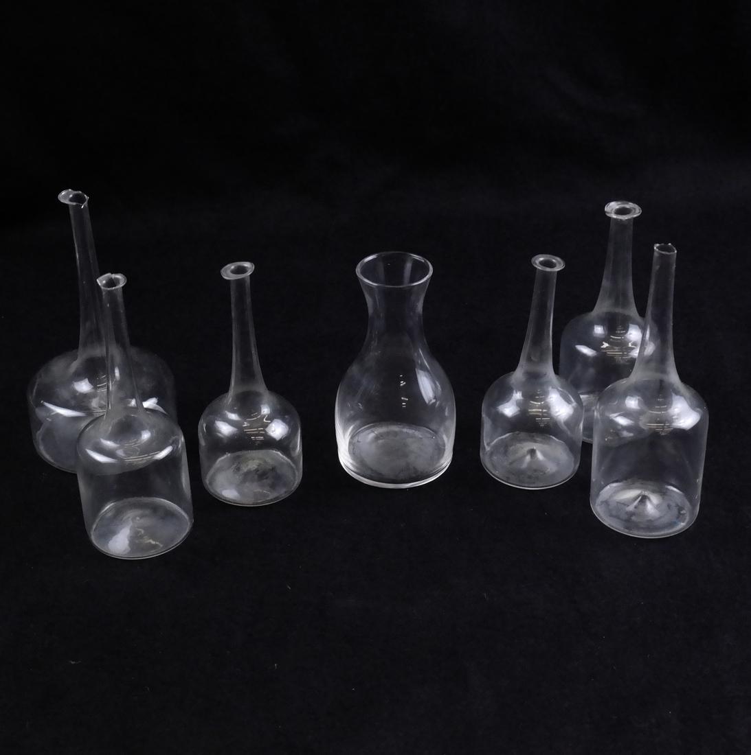 7 Miniature Modern Blown Glass Vessels: Probably Swedish, each blown glass vessel varies in size and form. [3" to 4" H]. Provenance: Property from the estate of Elaine Lustig Cohen.