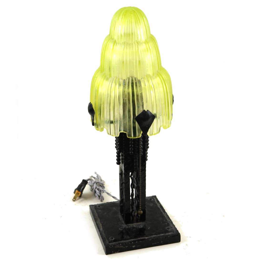 Art Deco Rocket-Form Table Lamp: Art Deco lamp with a vaseline glass shade on iron base. Dimensions: 5.5" W x 5.5" D x 16.5"H; shade - 5.5" ⌀ ;&n