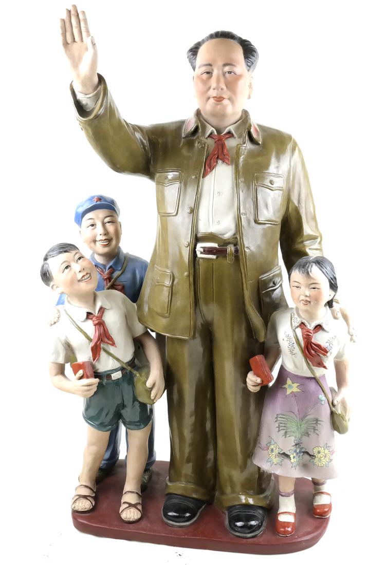 Cultural Revolution Sculpture Chairman Mao and Children: Signed, decorated porcelain group depicting Chairman Mao Zedong with outstretched hand while three children look upon him carrying their Little Red Books. Impressed signature on base, and numbered 147