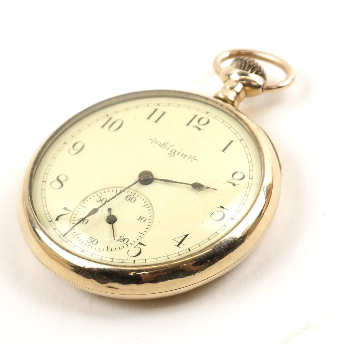 A 14k Yellow Gold Elgin Open Face Pocket Watch. (1 of 5)