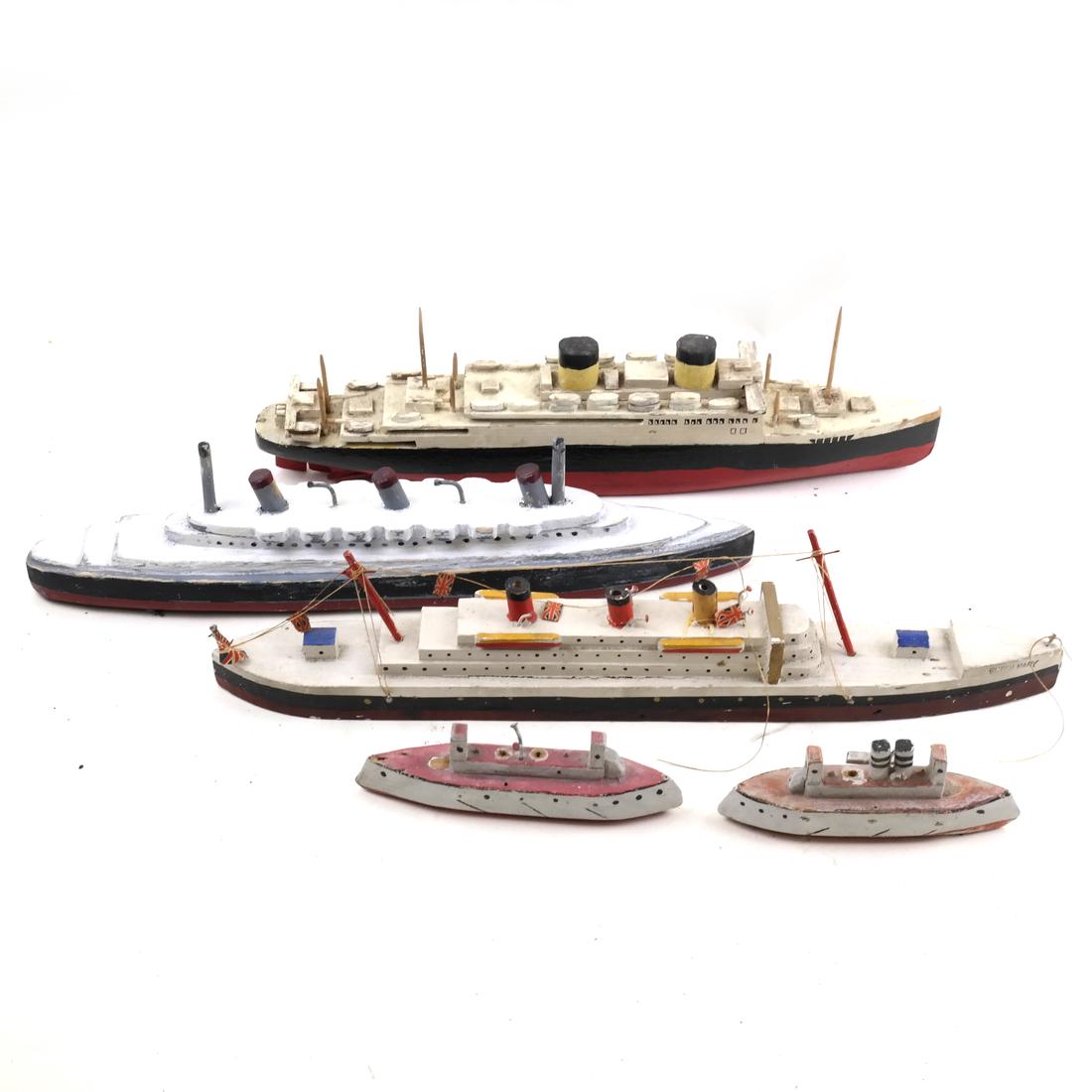 Group of Five Vintage Wood Oceanliner Models: Comprises a variety of ship models, some naively carved. Dimensions: 4.25" H x 12" W; 