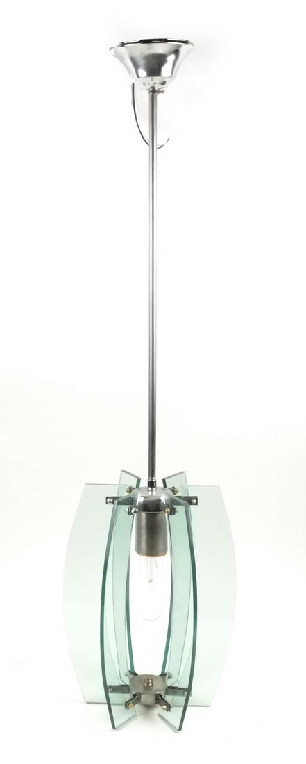 Tinted Glass Pendant Style Fixture: Tinted glass pendant style fixture. Dimensions: 7" ⌀ x 33" H; 