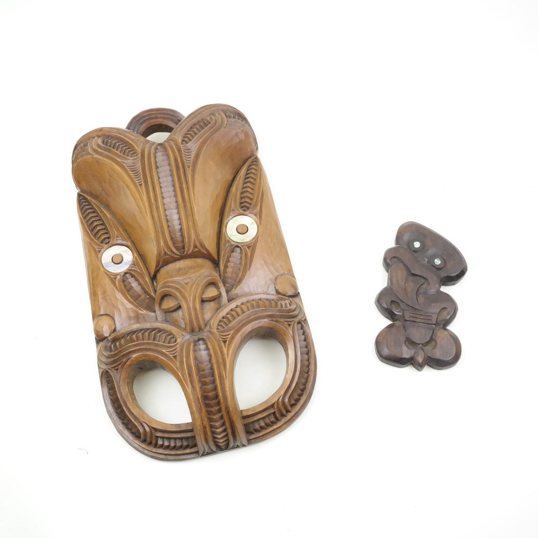 Signed Maori Carved Masks, Tony Thompson: Comprises two Maori carved masks signed "Tony Thompson."
