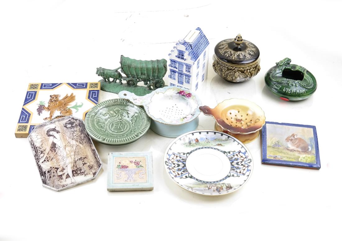 Group of Assorted Porcelain Items - Minton and Nippon: Porcelain items including makers Nippon, Minton, Delft, and Limoges. Includes miniature iron doorstops, Air Vietnam ashtray, Nippon tea strainers, Minton lion tile and two others, Russian saucer, stai
