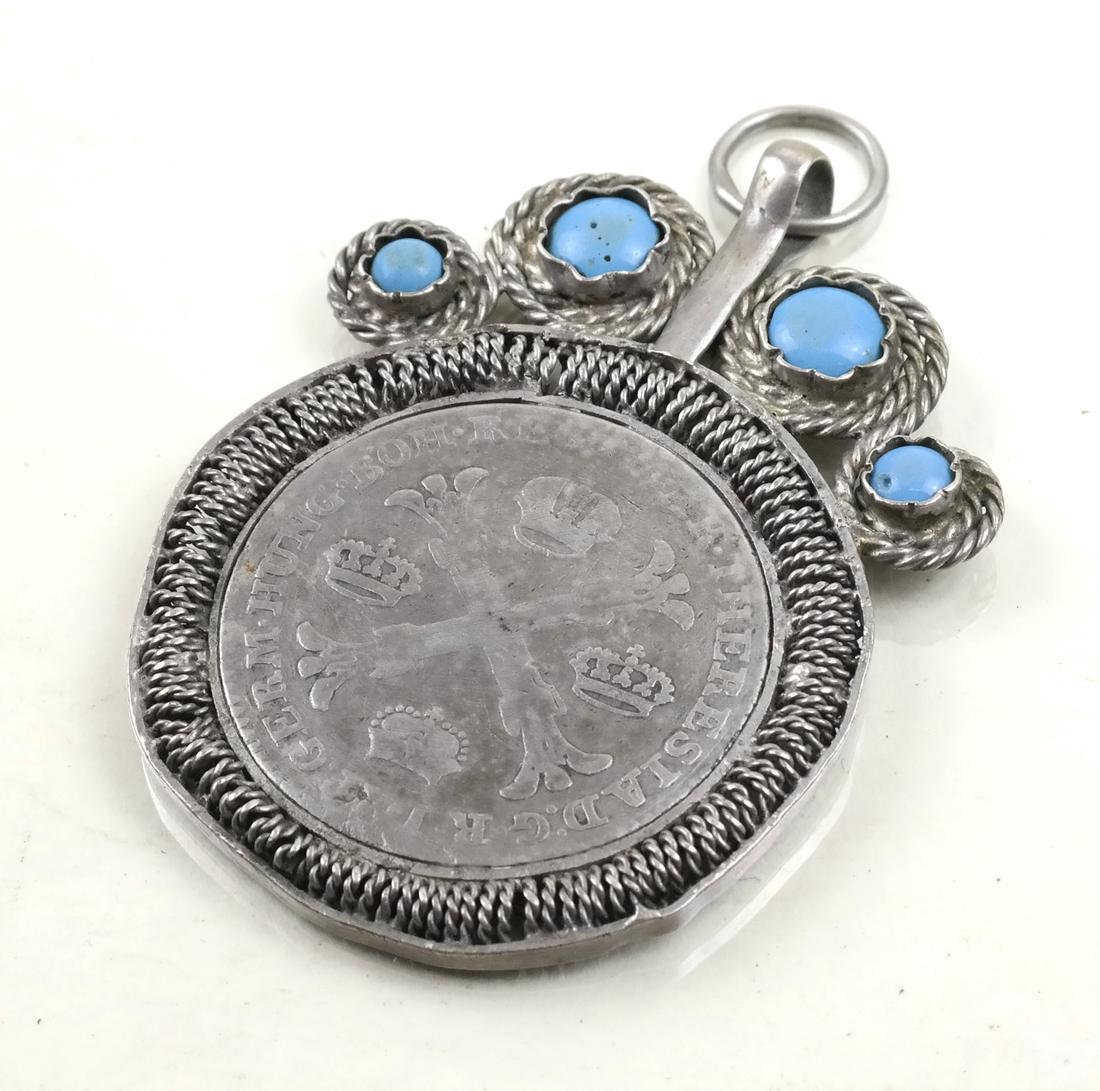 Austrian 1767 Coin Pendant: Mounted with paste in scrolling filigree bezel.