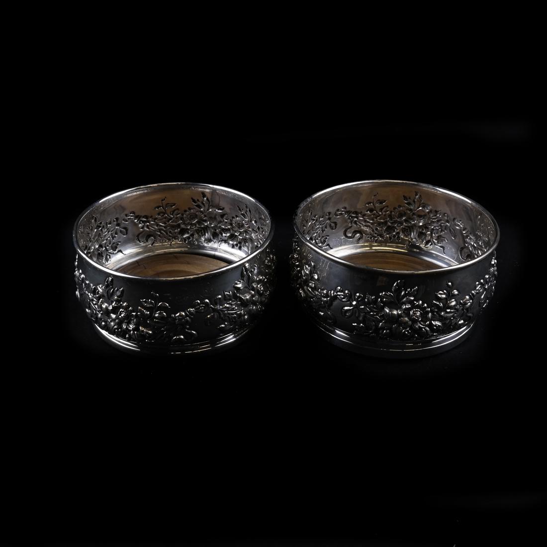 American Sterling Silver Wine Coasters by Mauser: Pair of American silver circular wine coasters each with wood base. Dimensions: 5.25" ⌀ x 2" H; 