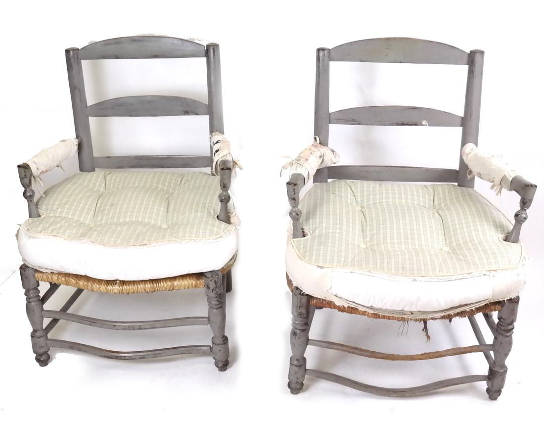 Pair of 19th Century French Painted Armchairs: Country ladder back armchairs with rush seats and double cross stretchers.