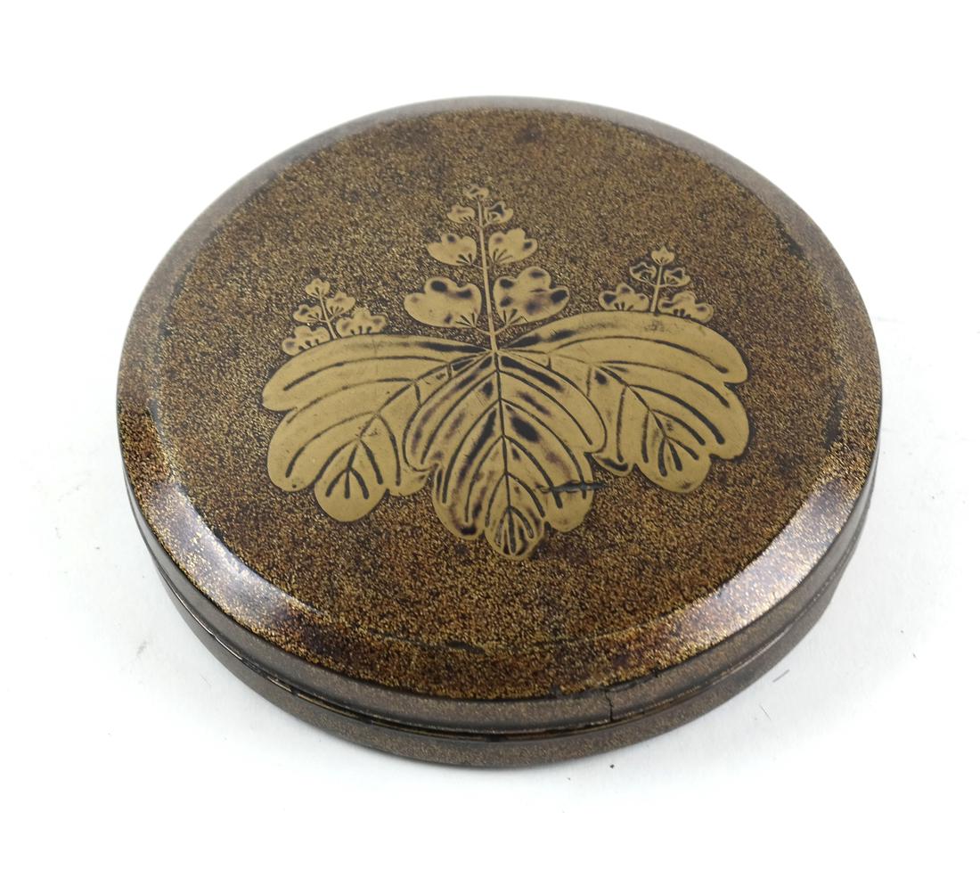 Japanese Lacquer Decorated Box: Circular box with a leaf medallion on the lid. Dimensions: 4.75" ⌀ ; 