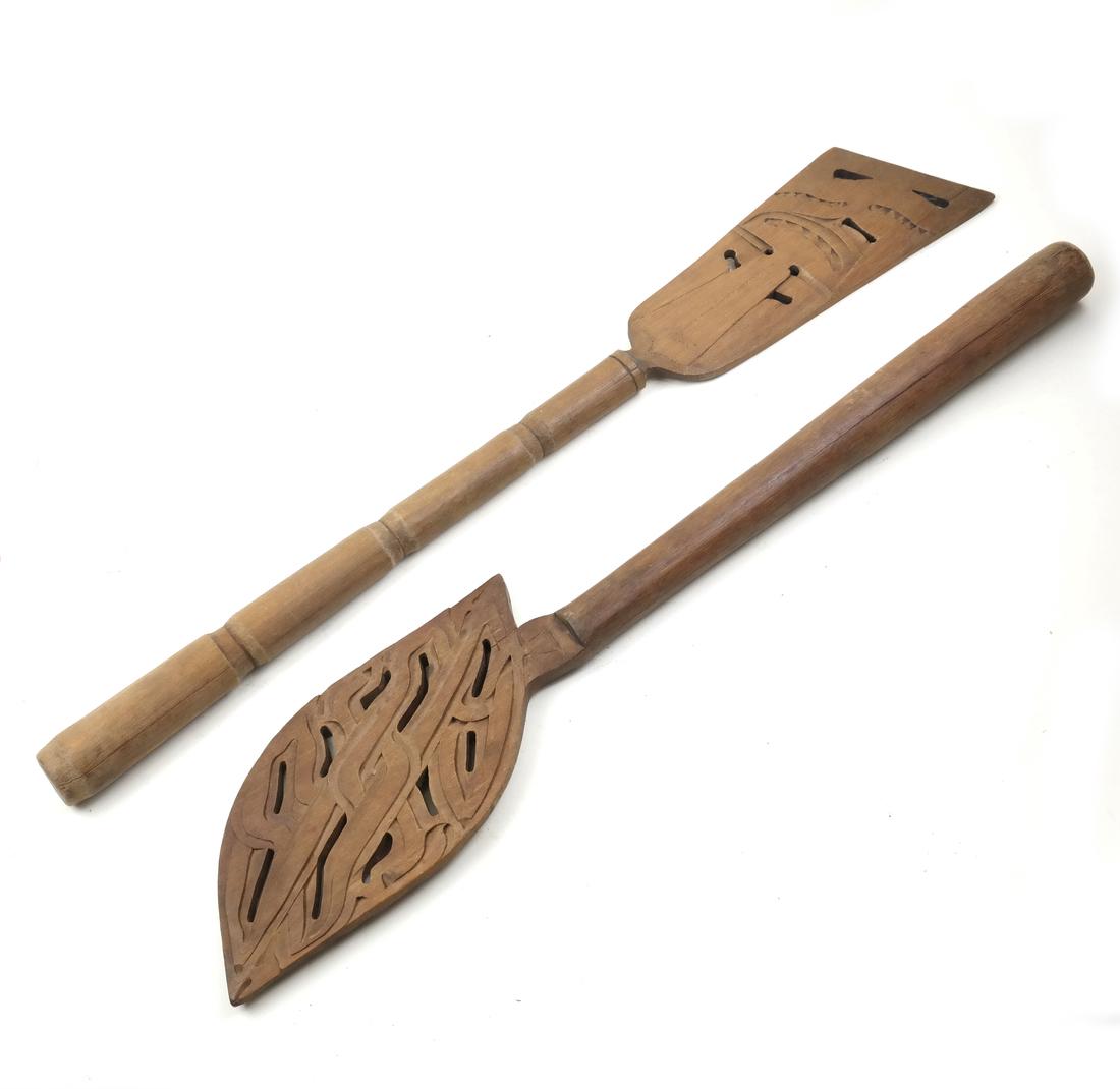 Two Maori-Style Paddles: Comprises two Maori-style paddles. Dimensions: Largest - 26" L ; 
