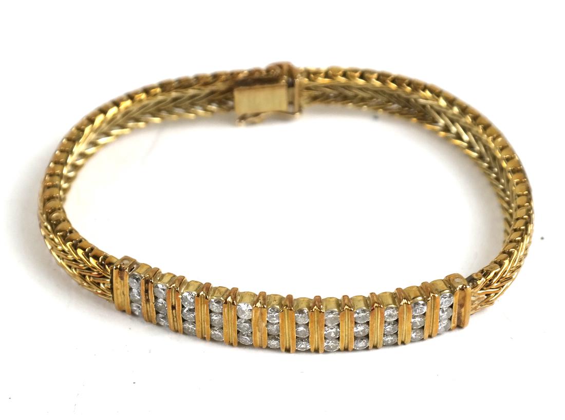 An 18k Yellow Gold Cable Design Bracelet (1 of 4)