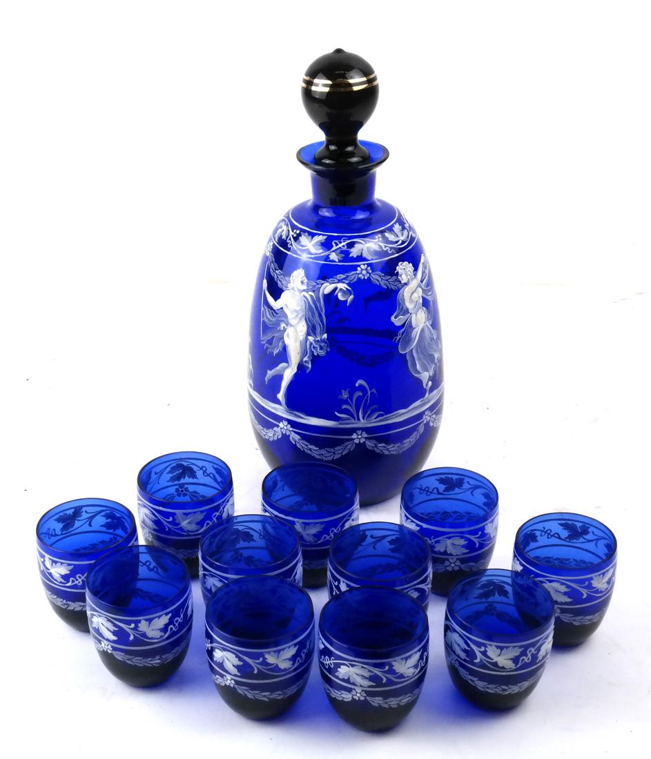 Twelve Pieces Cobalt Blue Liquor Set: Comprises 11 cobalt blue soft paste overlay shot glasses with matching decanter and mismatched stopper. Dimensions: Decanter - 8" H ; Decanter Without Stoppe