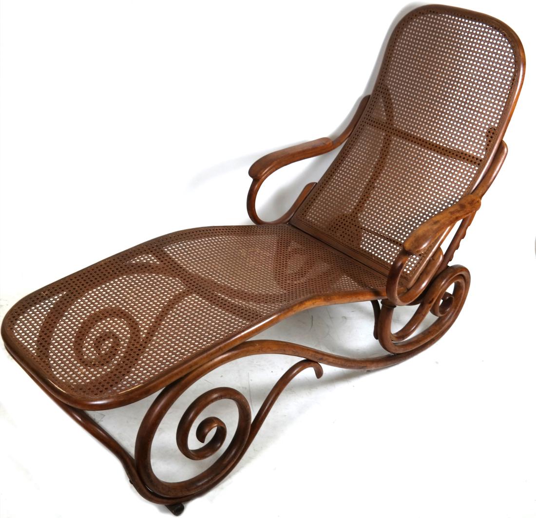 Vintage Thonet Caned Chaise: Vintage Thonet bentwood folding chaise, marked "Thonet." Dimensions: 26.5" W x 71" D x 28.5"H; Folded - 26.5" W x 