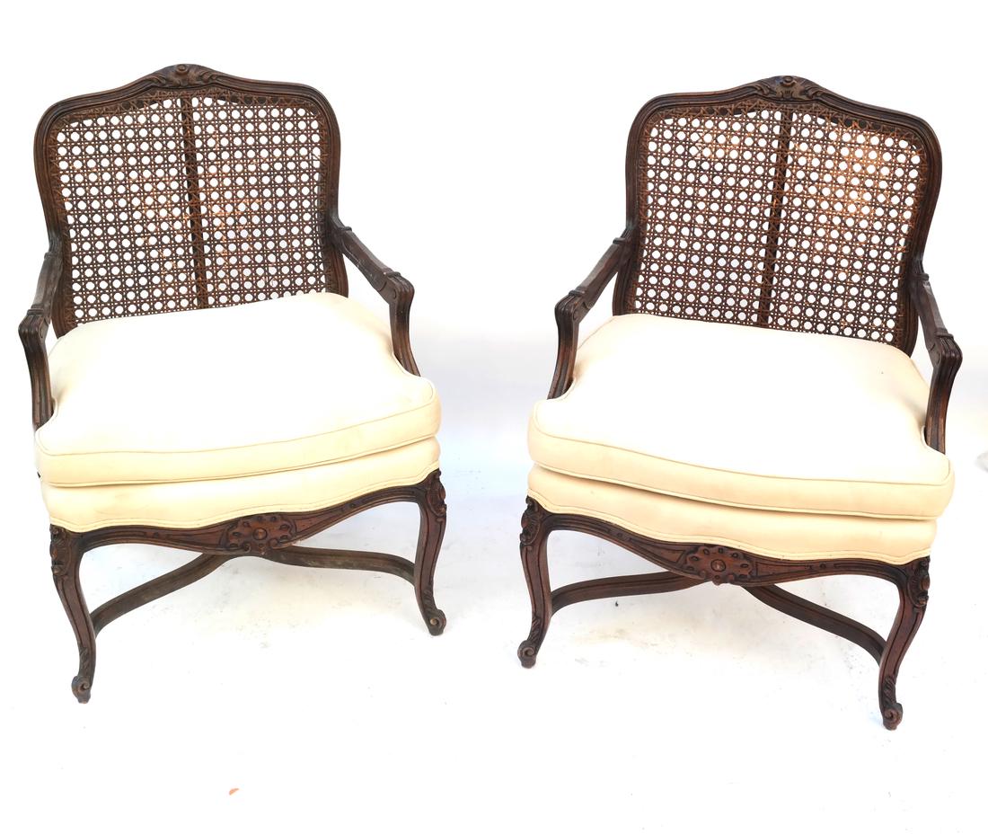 Pair of Provencial Armchairs: Pair of Provencial armchairs, each with caned backs and slip cushions. Dimensions: 26.5" W x 22" D x 37"H; 