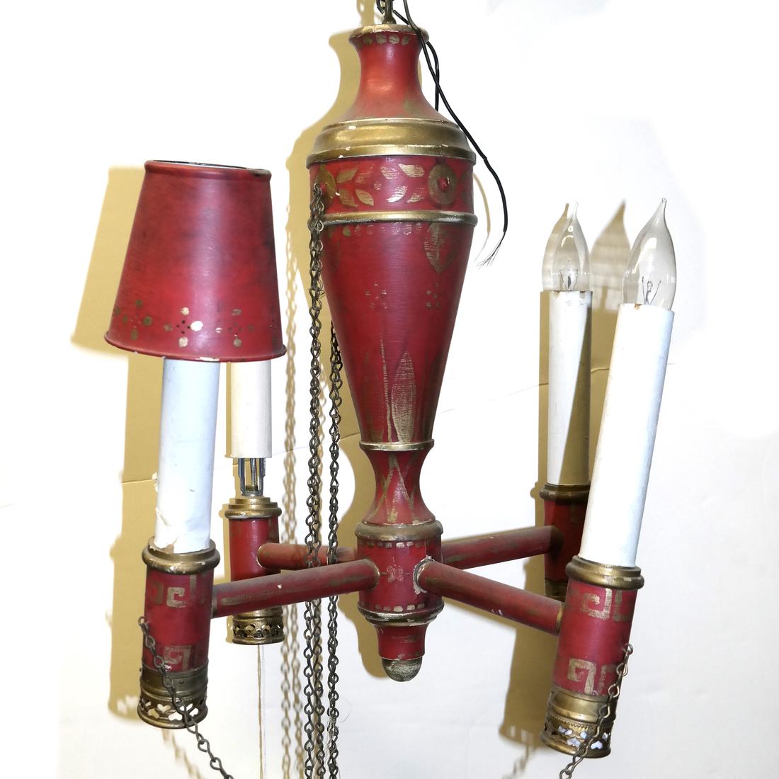 Red Decorated Four-Light Fixture: Red decorated four-light fixture.
