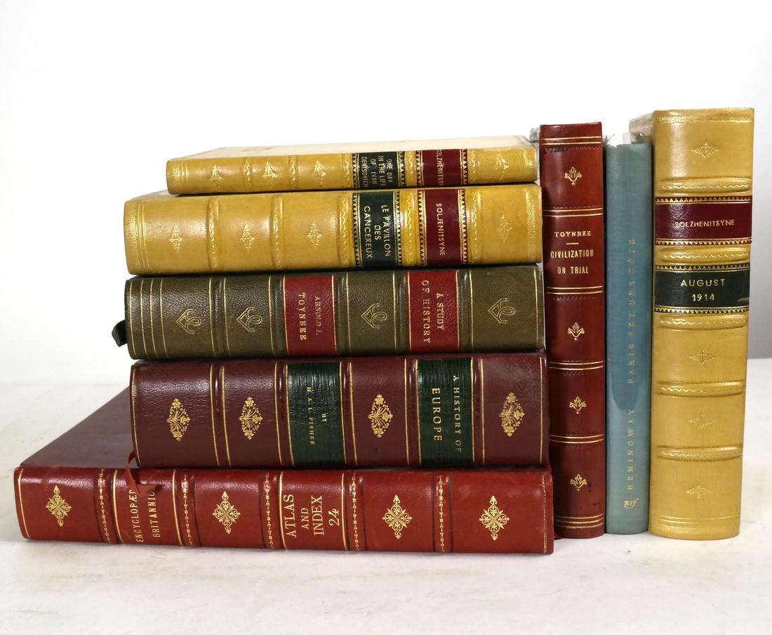 Seven Leatherbound Books: Including: Solzhenitsyn, Toynbee, and an early French edition of Hemingway, Une Fete a Paris. Gallimard.