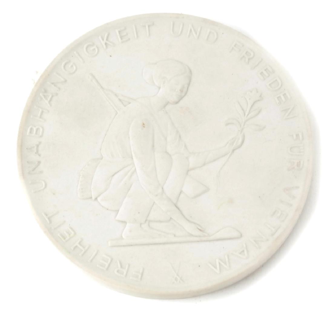 Meissen Porcelain Medallion: Vietnam raised porcelain medallion.