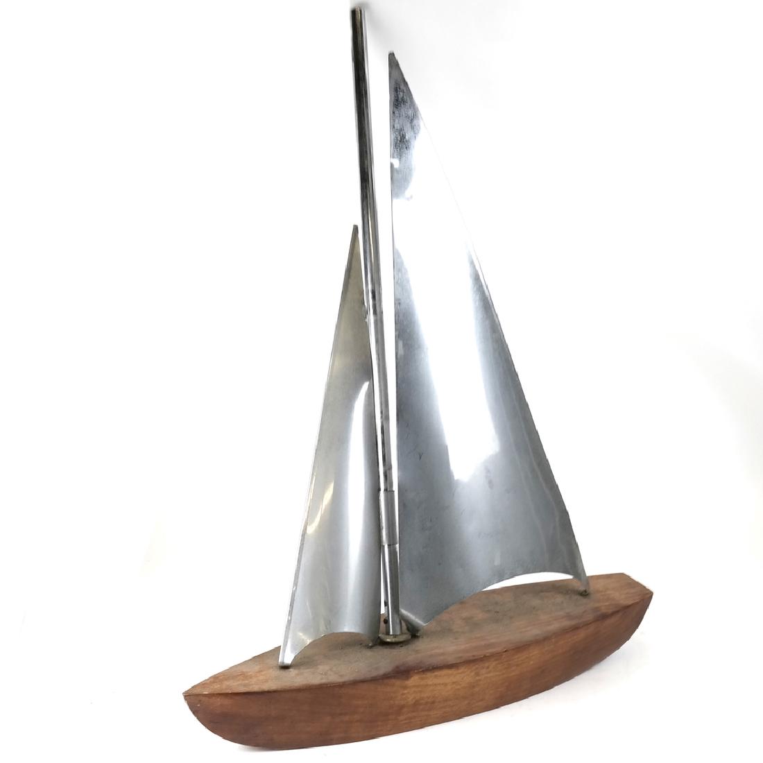 Walnut and Metal Sailboat: Walnut base model sailboat with steel sails.