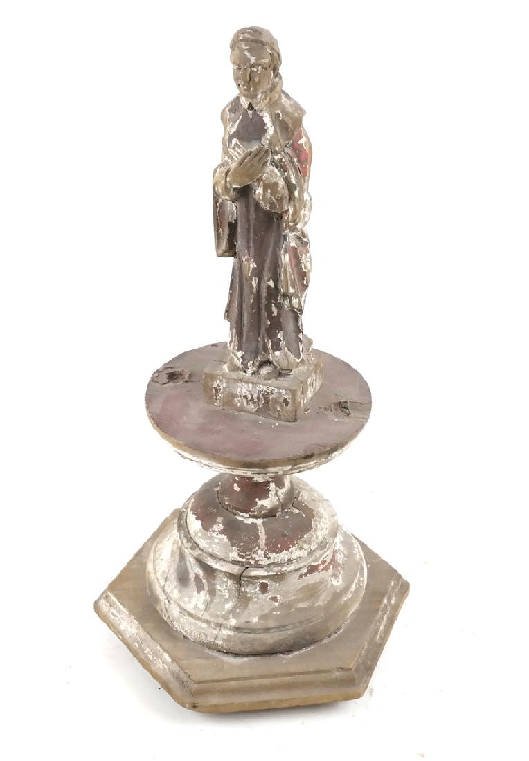 Central American Carved Wooden Santo Figure: Carved wood santo figure, on a pedestal base. Central American. Dimensions: 7" W x 7" D x 16"H; 