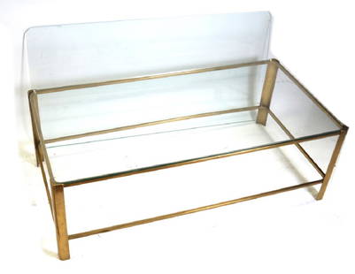 Brass and Glass Coffee Table by Maison Malabert: Brass frame two-tier coffee table, rectangular form, by Maison Malabert, French 1960. Stamped serial number to underside. Dimensions: 22" W x 43" D x 15"H;