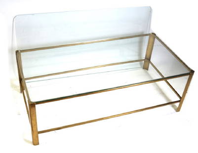 Brass and Glass Coffee Table by Maison Malabert: Brass frame two-tier coffee table, rectangular form, by Maison Malabert, French 1960. Stamped serial number to underside. Dimensions: 22" W x 43" D x 15"H;